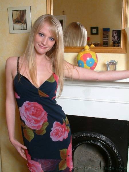 Nice Blonde Chickie Sharon Posing In Dress And Lingerie By The Fireplace photos (Sharon Onlytease) on dailyfans.net
